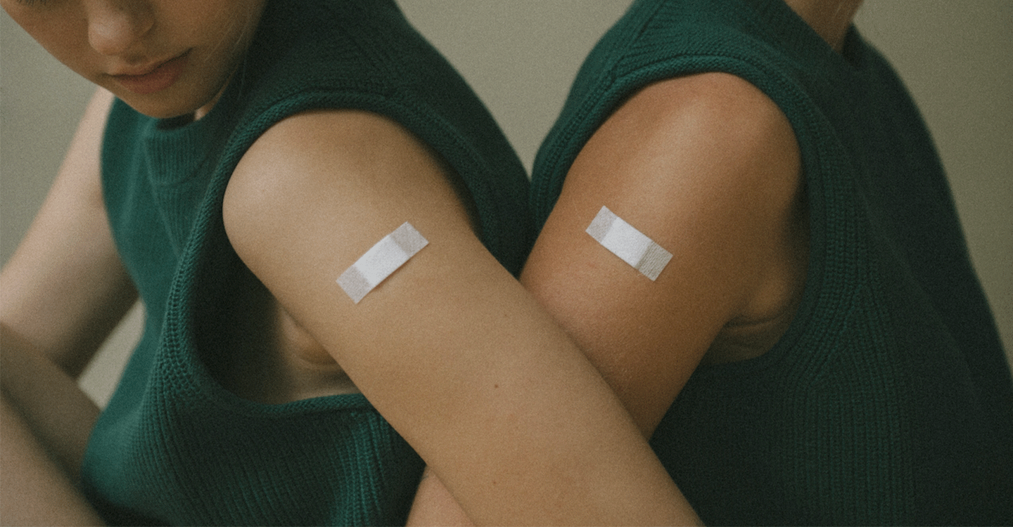 Women with band-aids on arms